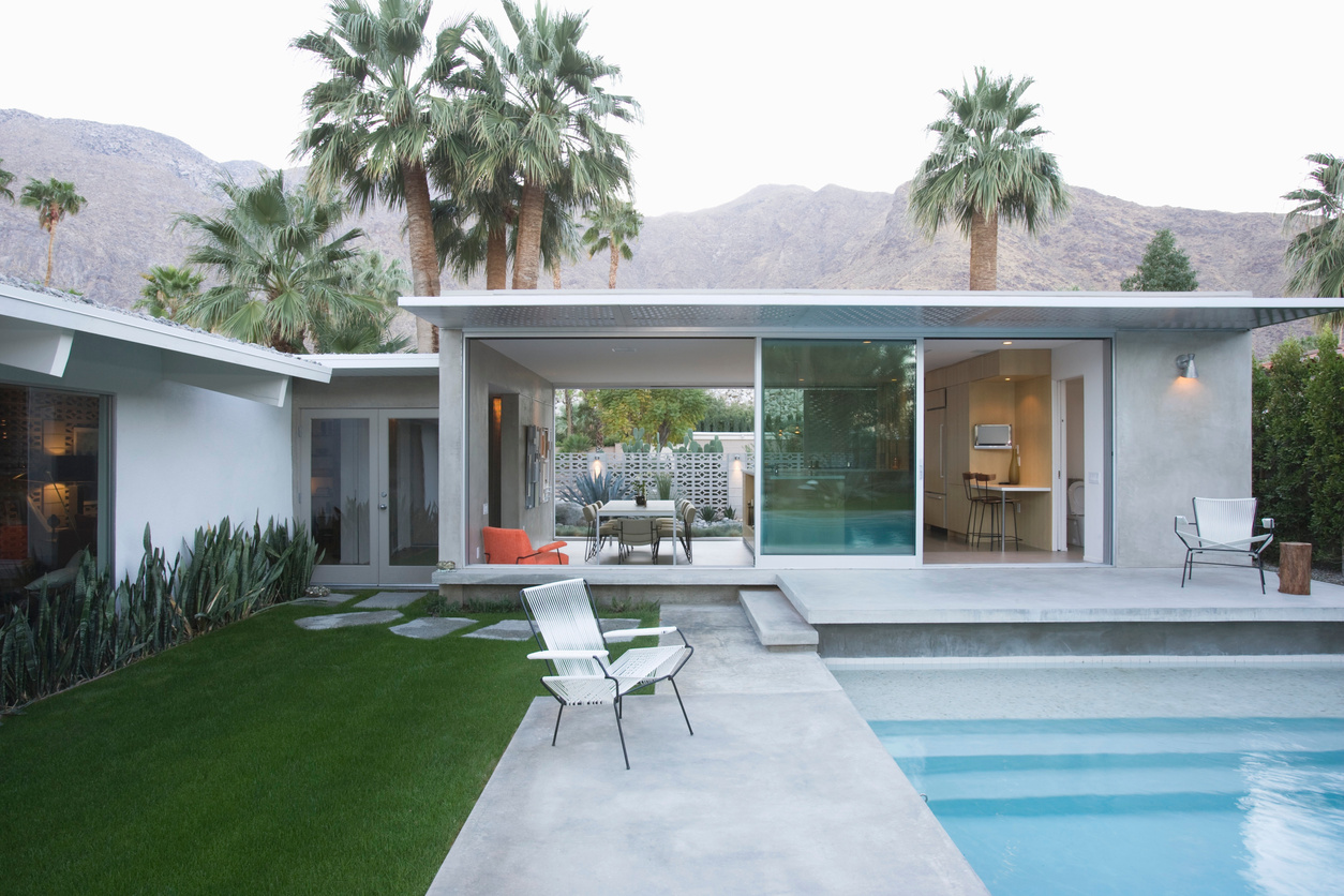 Palm springs swimming pool and home exterior